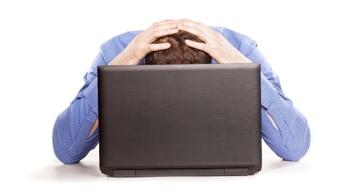 Frustrated man on computer