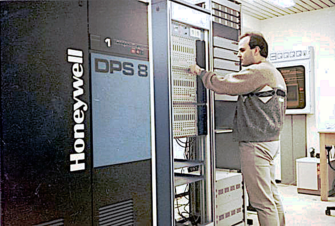 A man standing in front of a Honeywell DPS8 System